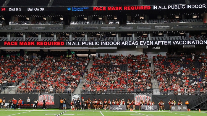 Nightly 9-7-21 photo 1 Video screens display a message about required mask wearing after Covid-19 vaccinations during a game between the Eastern Washington Eagles and the UNLV Rebels at Allegiant Stadium in Las Vegas.