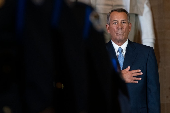 Nightly 4-6-21 photo Former House Speaker John Boehner stands for the pledge of allegiance during a ceremony to unveil a portrait in his honor in the U.S. Capitol in 2019.