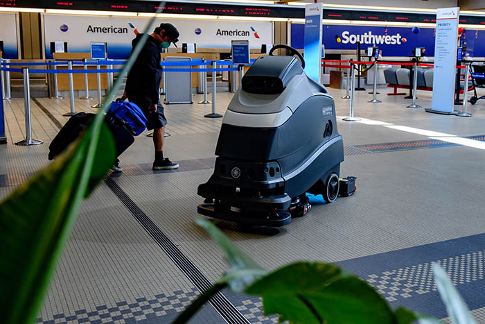5/8 Nightly Photo A UV cleaning robot cleans the floor at Pittsburgh International Airport.