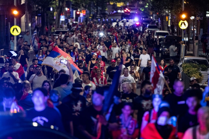 Nightly 1-10-22 photo 4 Serbian tennis fans march along Collins Street in support of Novak Djokovic in Melbourne, Australia.
