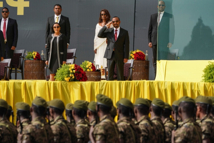 Nightly 10-4-21 photo 2  Prime Minister Abiy Ahmed salutes members of the Ethiopian Military as they march during an inaugural celebration after Amhed was sworn in for a second five-year term in Addis Ababa, Ethiopia.