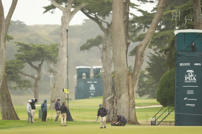 Members of the grounds crew maintain a green before the start of the second round of the 2020 PGA Championship at TPC Harding Park in San Francisco.