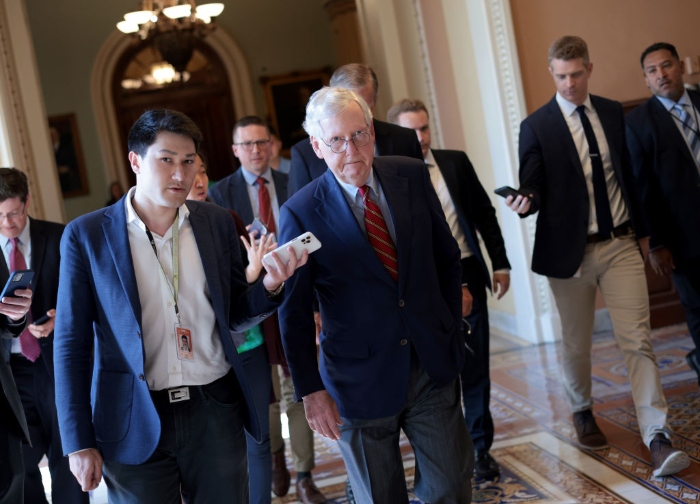 Nightly 7-13-21 photo Senate Minority Leader Mitch McConnell answers questions from reporters as he arrives at the U.S. Capitol.