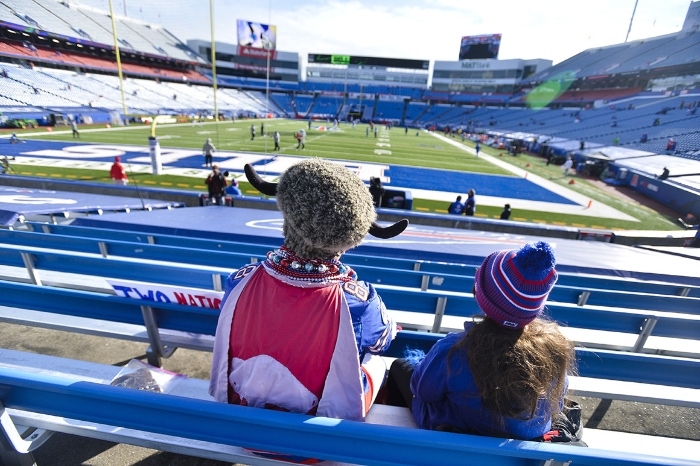 Buffalo Bills fans watch their team warm up before an NFL wild-card playoff football game against the Indianapolis Colts on Jan. 9, 2021, in Orchard Park, N.Y.