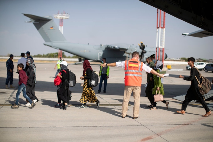 Nightly 8-23-21 photo 2 In this handout image provided by the Bundeswehr, evacuees from Kabul arrive in Tashkent, Uzbekistan.