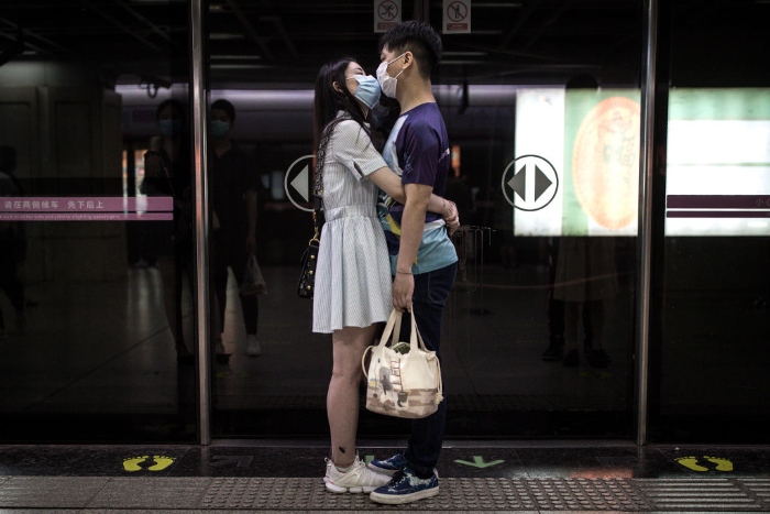 Nightly 6/8 photo 1 A couple hug in the subway station in Wuhan, China.Wuhan has seen its urban life gradually get back to normal following encouragement from local city management to open up street-stalls.