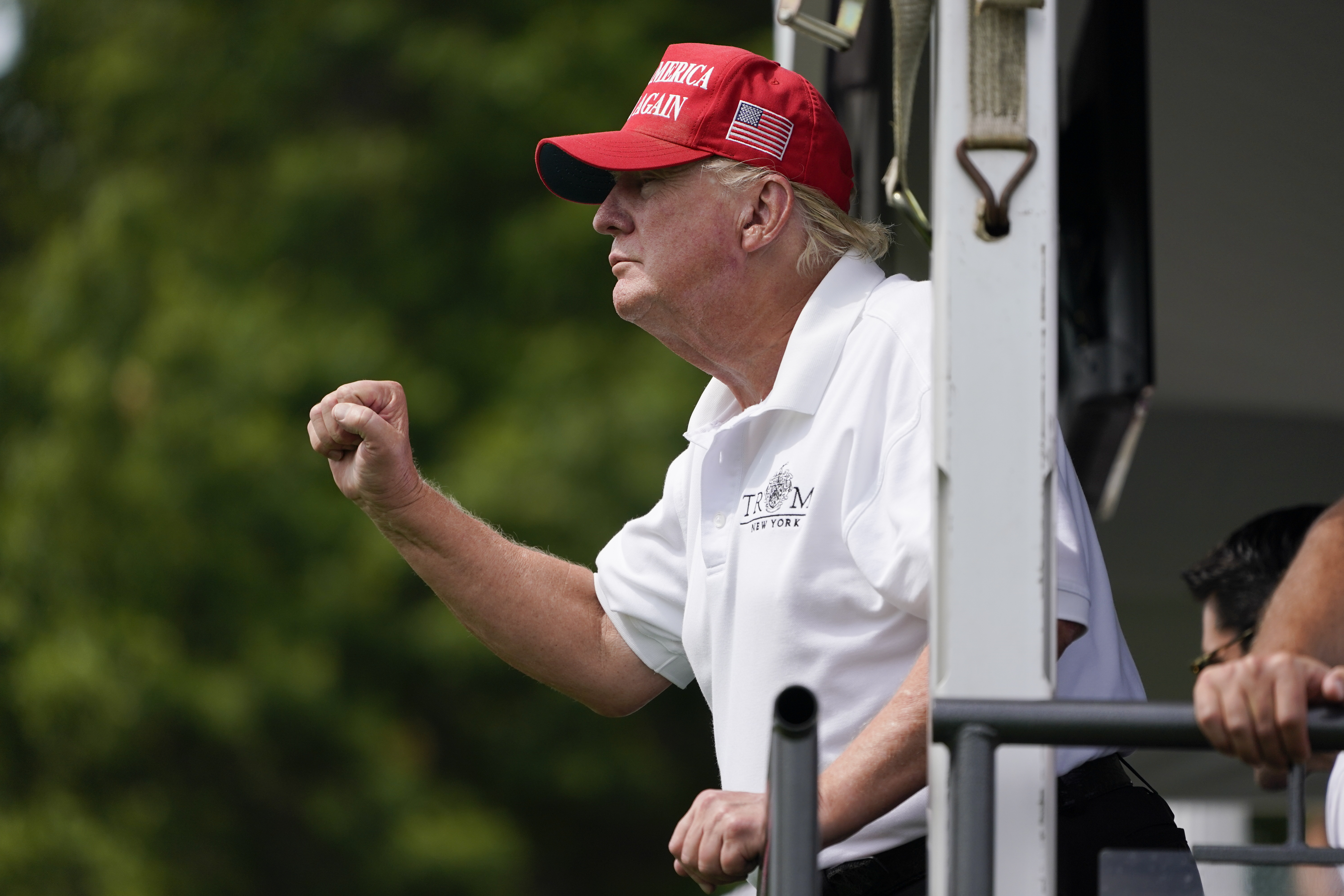 Former President Donald Trump watches a game at his Bedminster golf club.