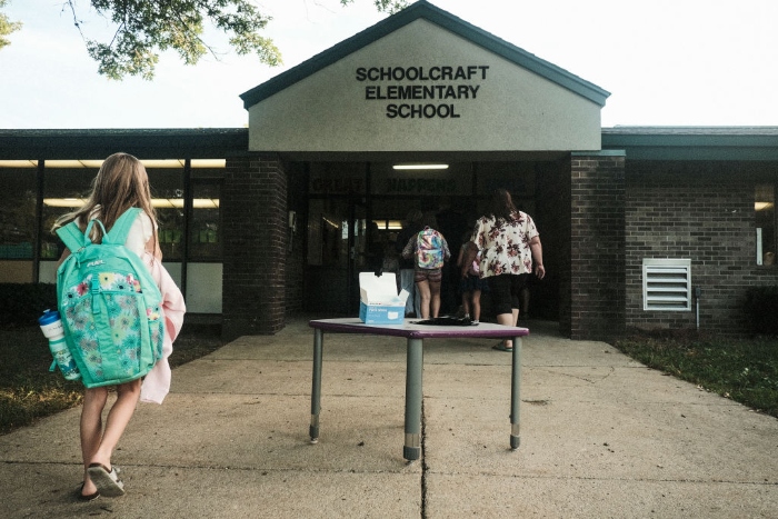 Nightly 10-5-21 photo Face masks sit on a table outside of Schoolcraft Elementary for students and parents to wear when entering the building in Schoolcraft, Mich.