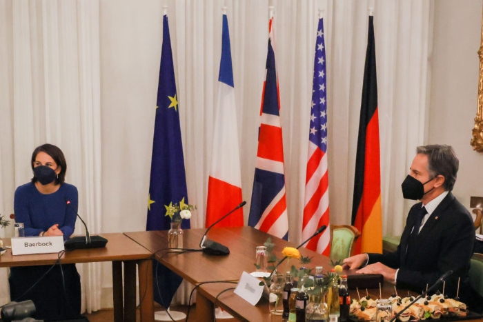 German Foreign Minister Annalena Baerbock and U.S. Secretary of State Antony Blinken sit next to each other at a foreign ministers talk round during the 58th Munich Security Conference.
