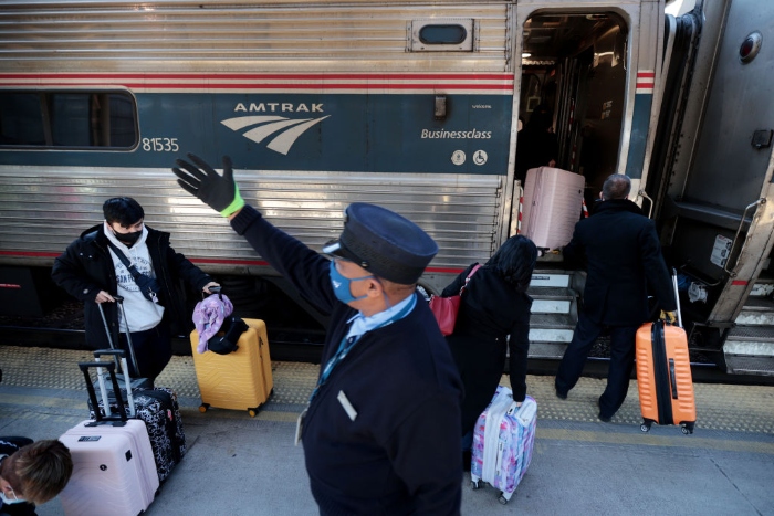 Nightly 11-24-21 photo 4 Passengers board a train bound for Boston on the day before Thanksgiving at Union Station in Washington, D.C.