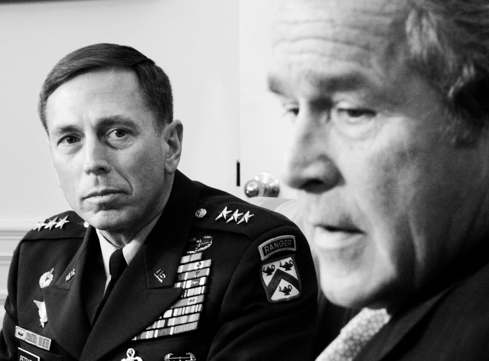 Nightly 9-9-21 photo 1 Gen. David Petraeus watches as President George W. Bush speaks during a meeting in the Oval Office on Jan. 26, 2007.