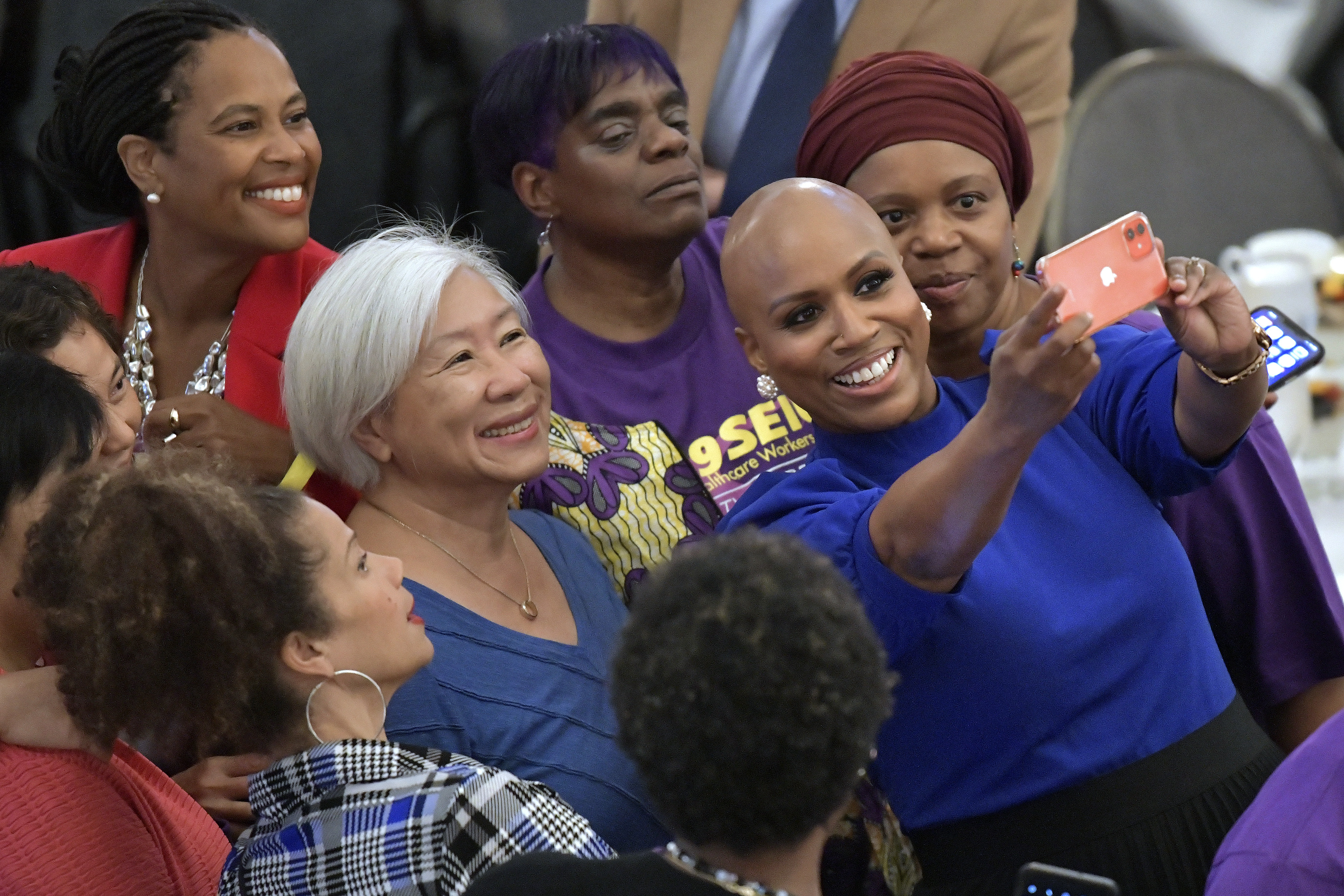 Rep. Ayanna Pressley (D-MA) takes a photo with supporters at the Annual Greater Boston Labor Council Breakfast on Monday, Labor Day, Sept. 5, 2022 at the Park Plaza Hotel in Boston. (AP Photo/Josh Reynolds)