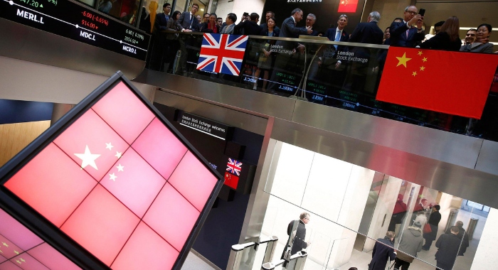 Nightly 10-14-21 photo 2 The flags of the U.K. and China hang at the London Stock Exchange.