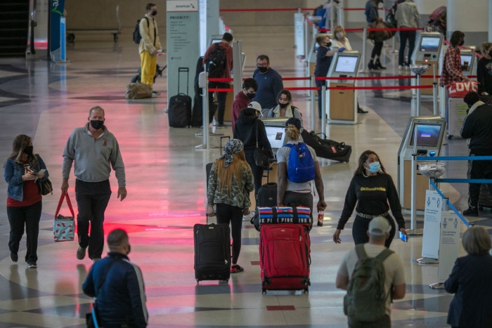 Holiday travelers pass through Los Angeles international Airport on Thanksgiving eve.