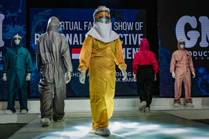 Medical workers showcase designs during a virtual fashion show of personal protective equipment in Yogyakarta, Indonesia. 