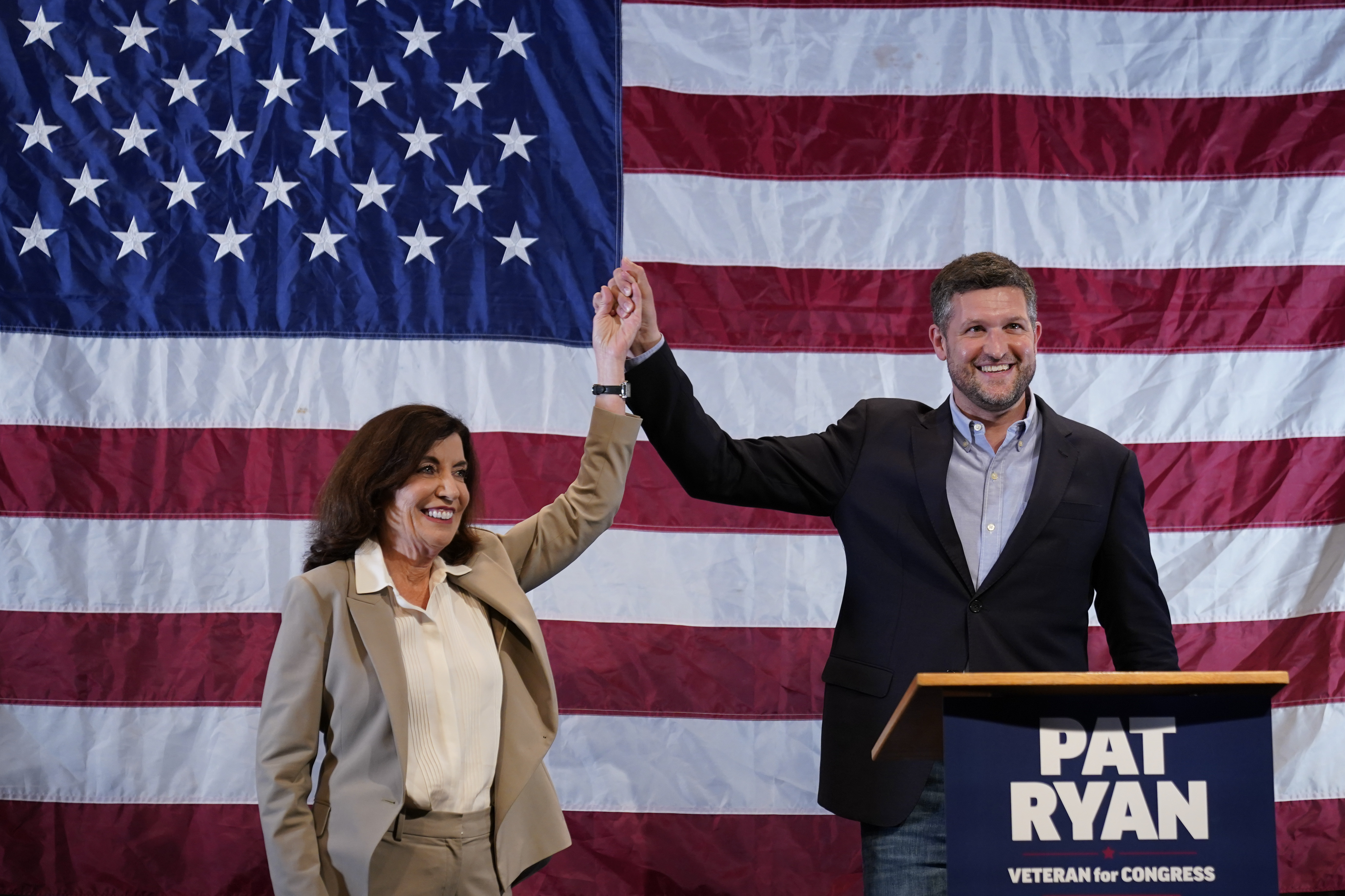 Democratic candidate Pat Ryan and New York Gov. Kathy Hochul appear on stage together during a campaign rally for Ryan.