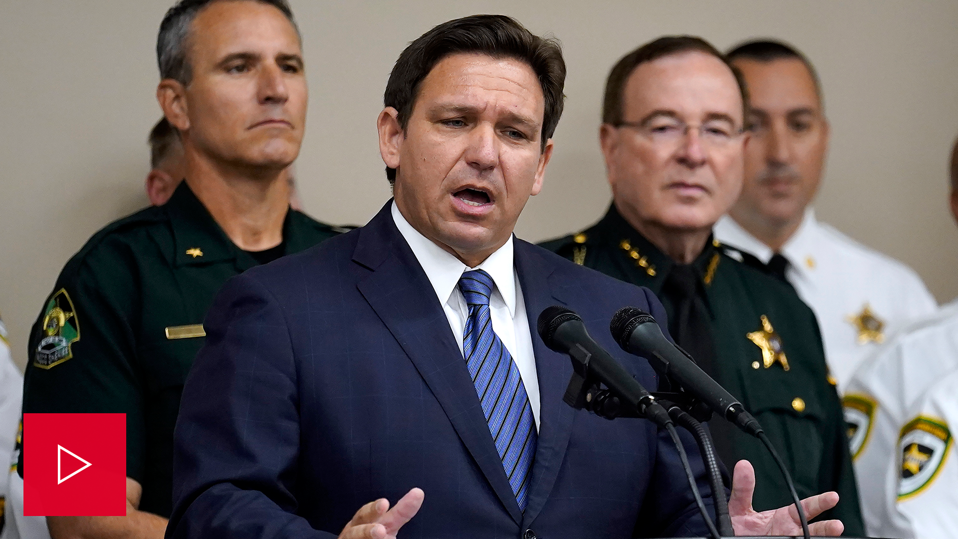 A video of Ron DeSantis holding a news conference. 