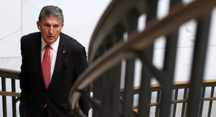 9-20_Manchin_Nightly_700 Sen. Joe Manchin (D-W.Va.) leaves a hearing on Capitol Hill.