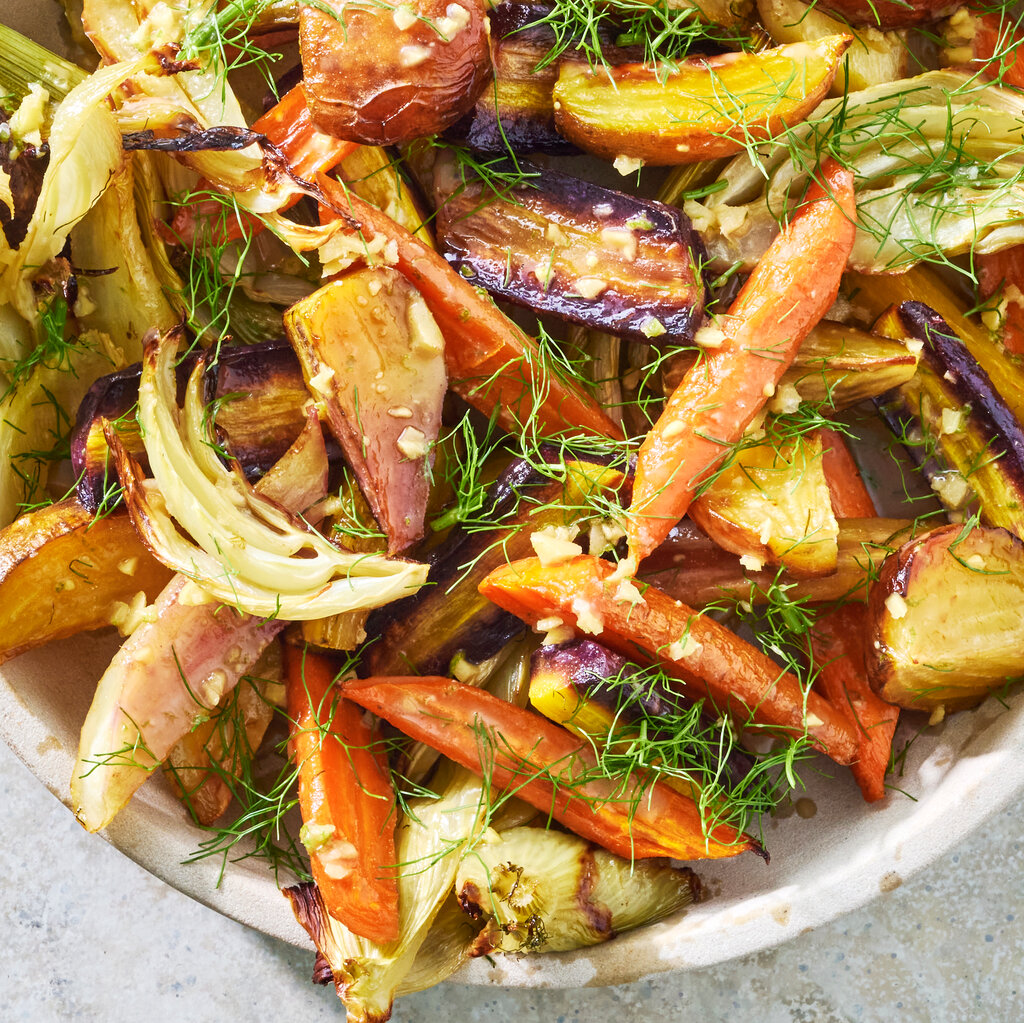 Chopped yellow beets, orange and purple carrots and white fennel, topped with fresh dill. 