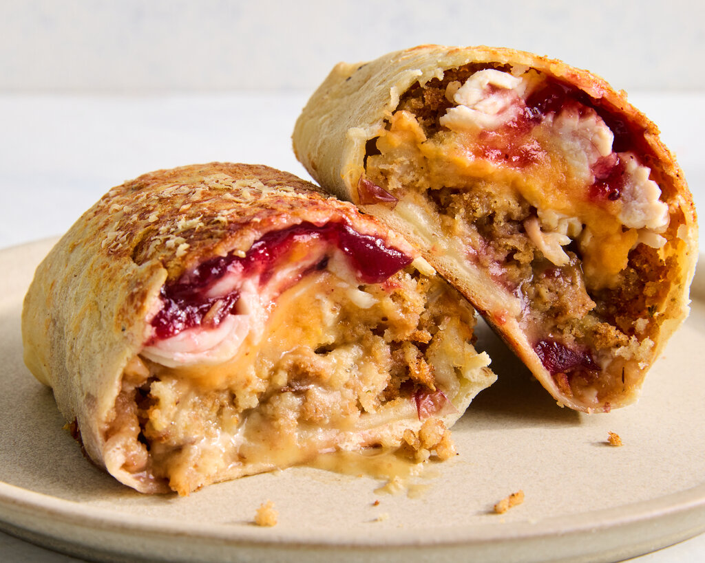 An image from the side of Thanksgiving leftovers in a hot pocket-style wrap.