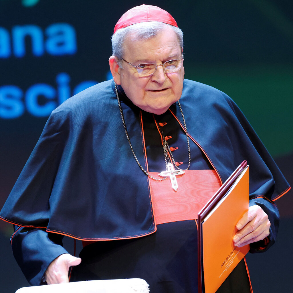 Cardinal Raymond Burke, in black robes and a red cap.