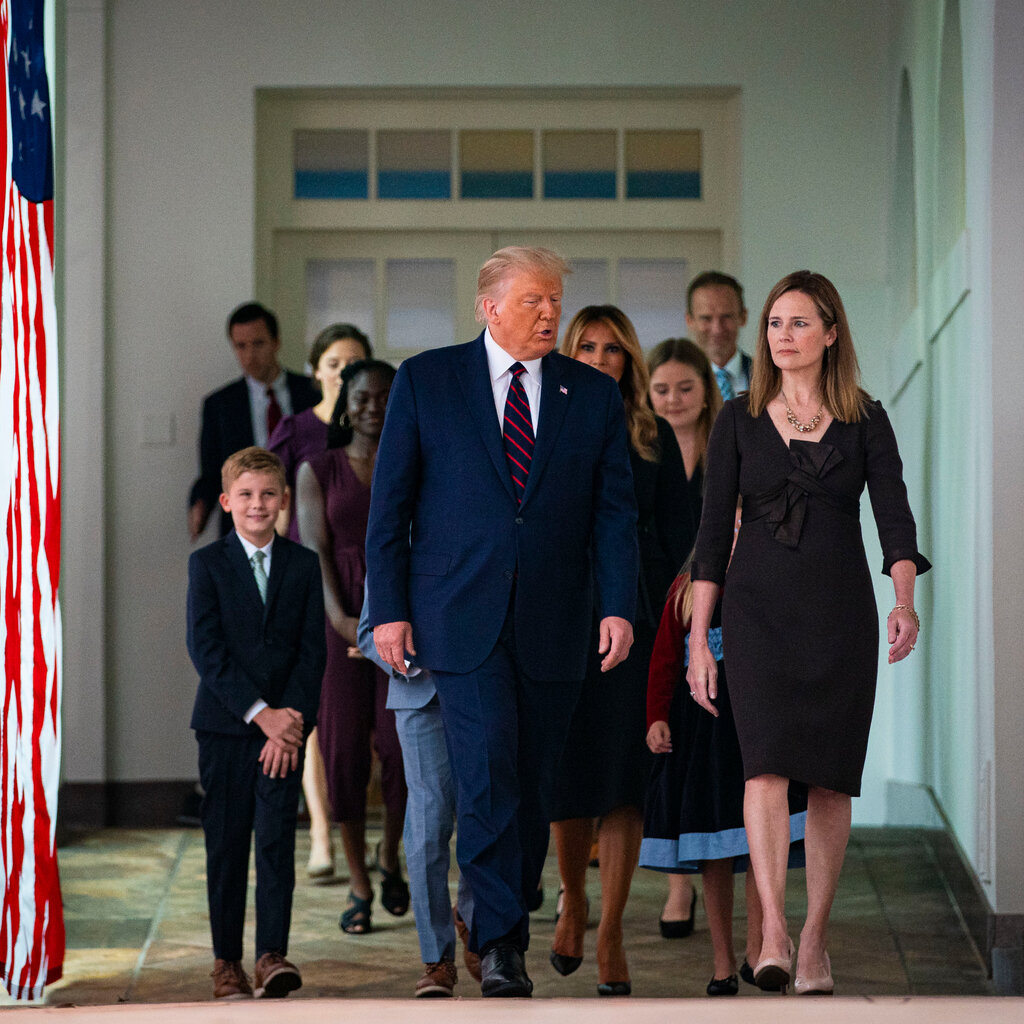 President Donald Trump walks with Judge Amy Coney Barrett and her family after being announced as his pick to be the next Supreme Court Associate Justice, in 2020.