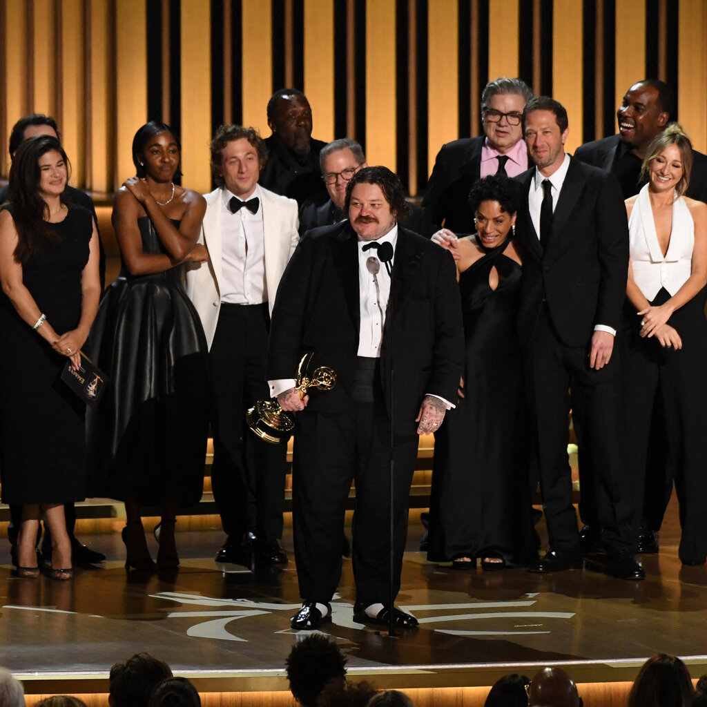 The cast of the bear receiving their Emmy award on stage. 