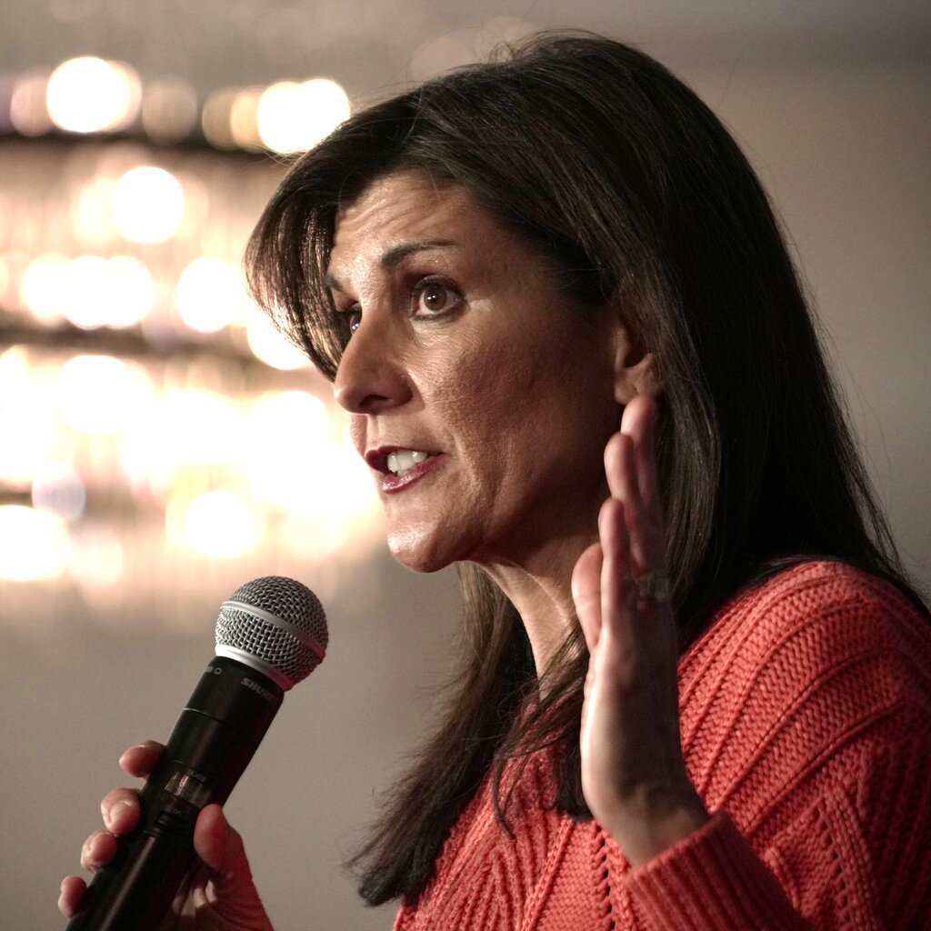 Nikki Haley speaking into a microphone. 
