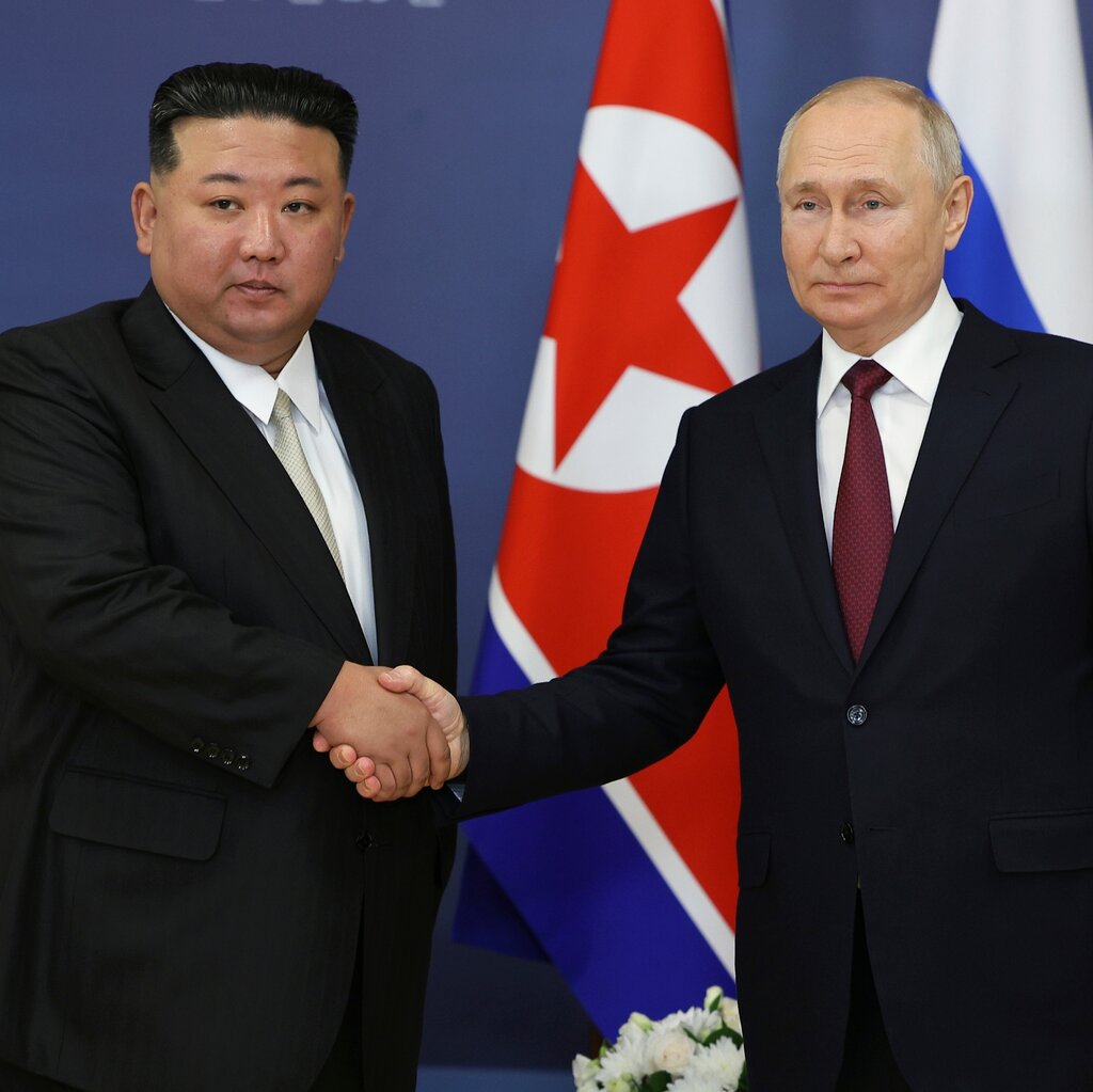 Kim Jong-un and President Vladimir V. Putin shaking hands.