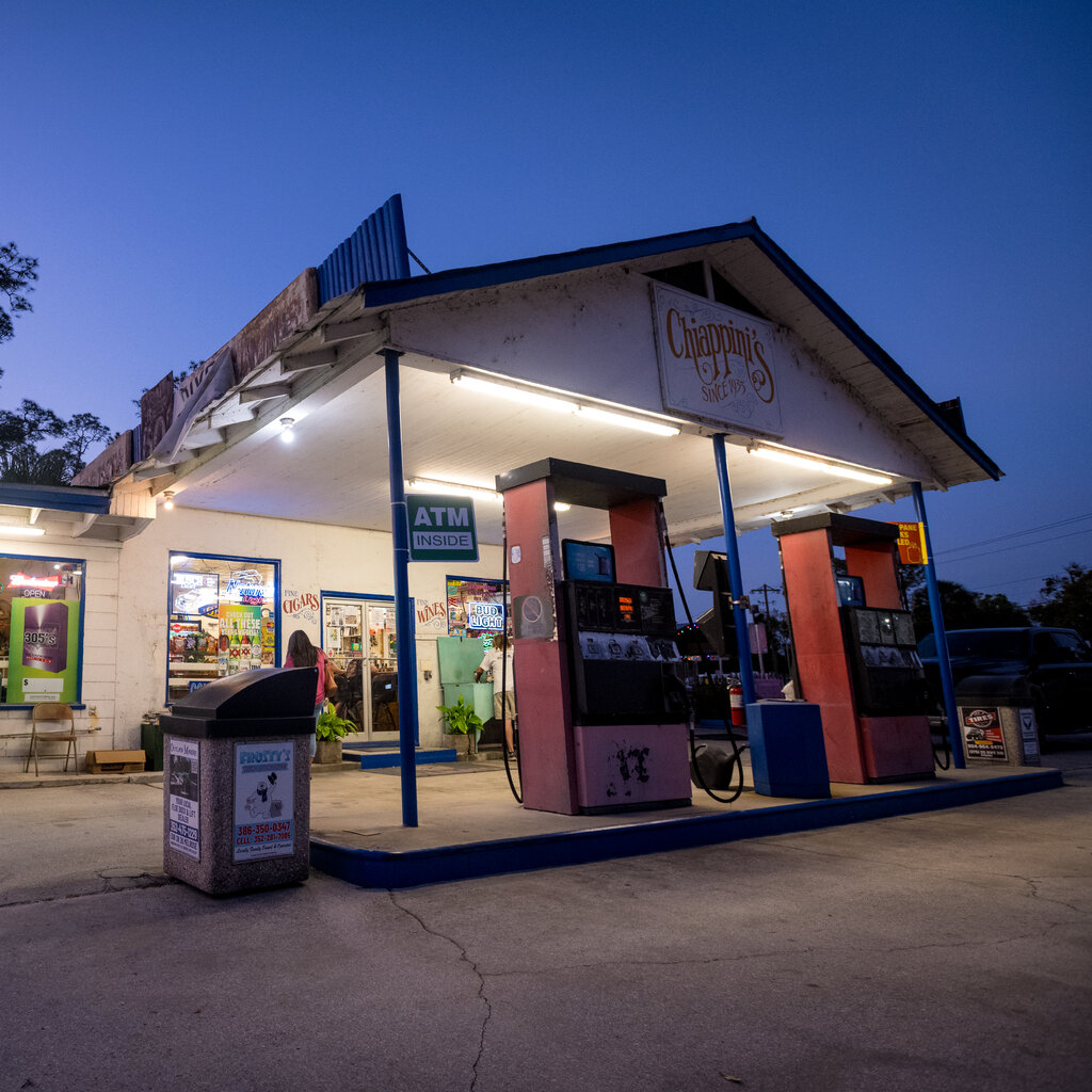 A rural gas station at dusk.
