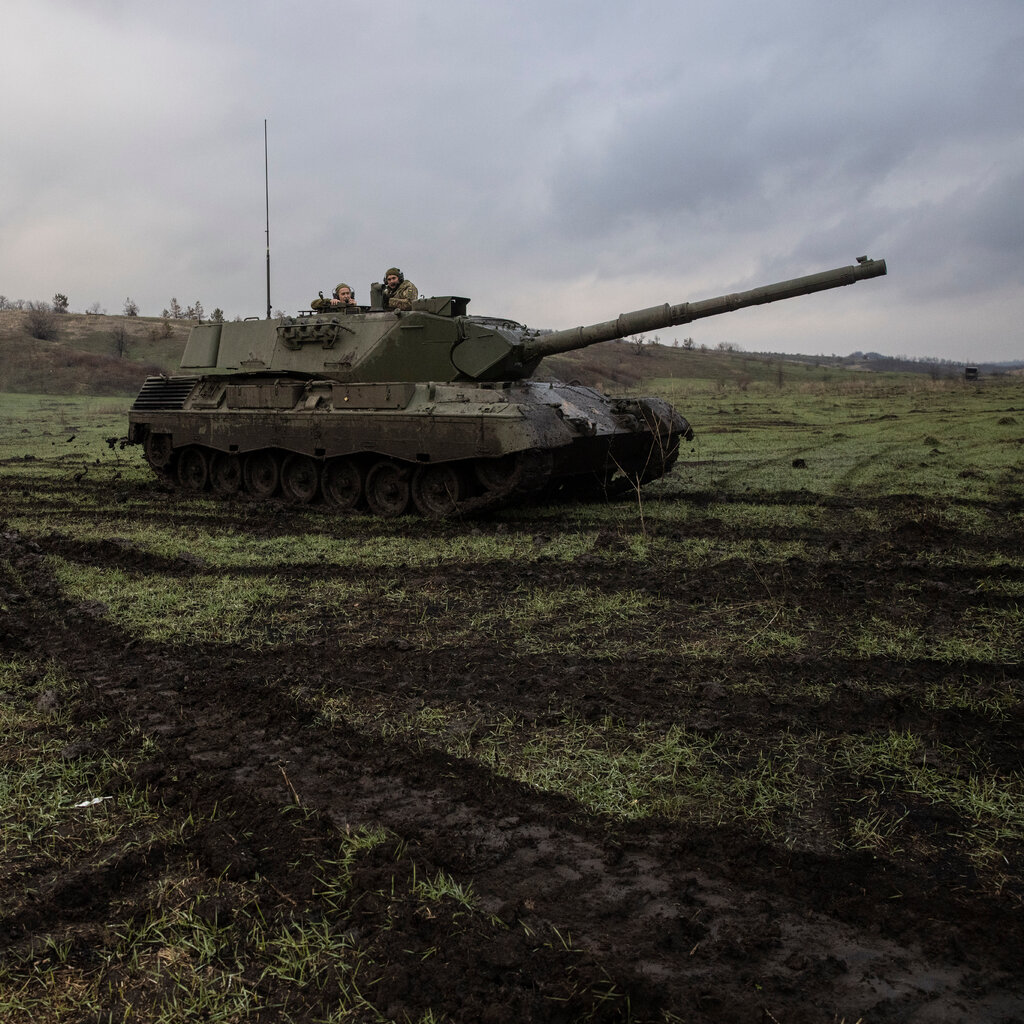 A tank in a muddy field. 
