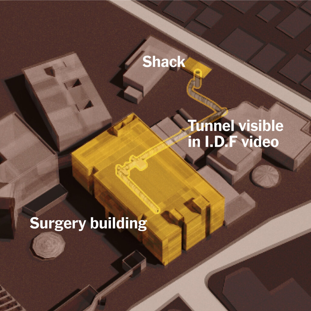 A computer generated image of buildings and the words, "shack," "Tunnel visible in I.D.F video" and "Surgery Building" over the buildings. 