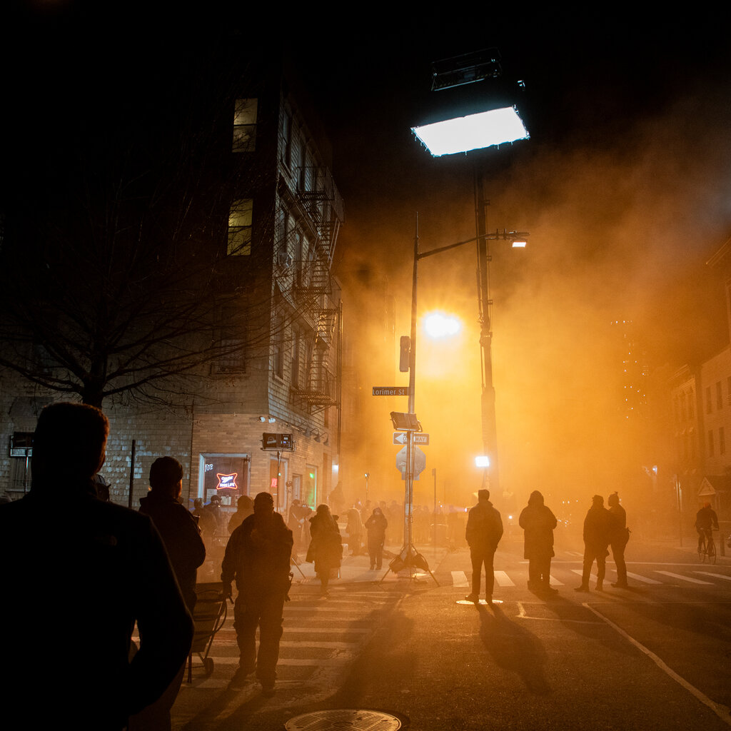 A film crew on the streets of New York at night. 