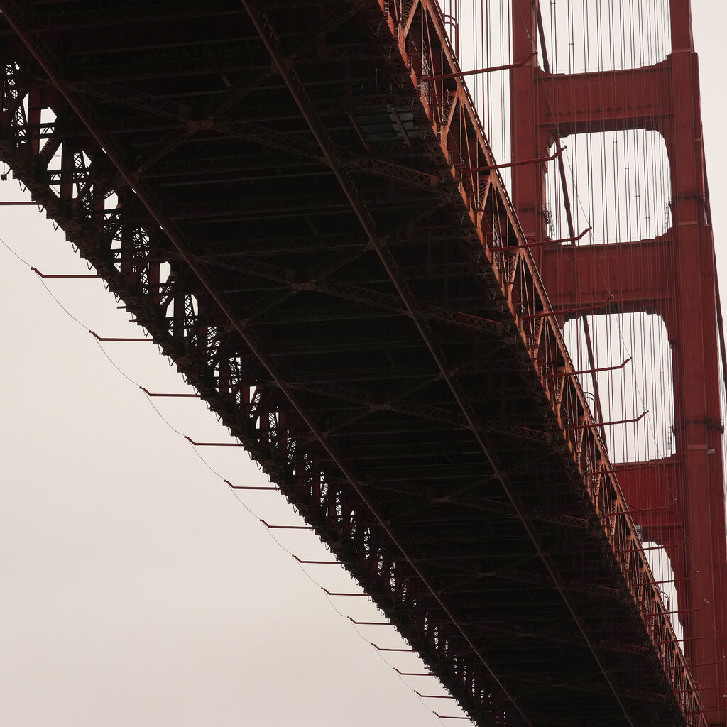 A large net extends from the side of the Golden Gate Bridge. 
