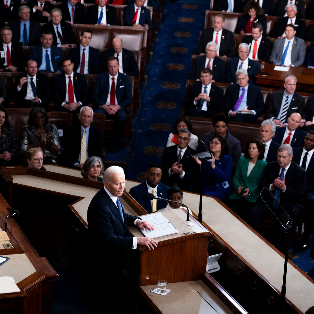 President Biden in a suit seen from above in the House chamber delivering the State of the Union address.