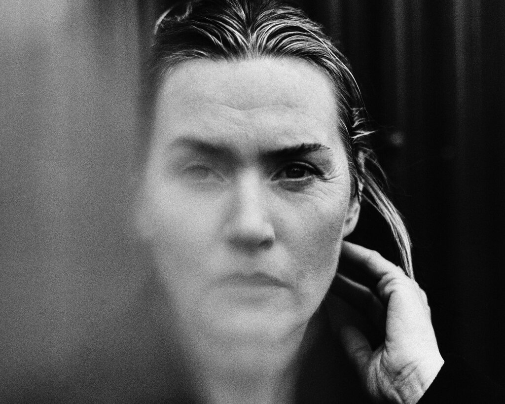 A black-and-white photograph of Winslet slightly obscured.