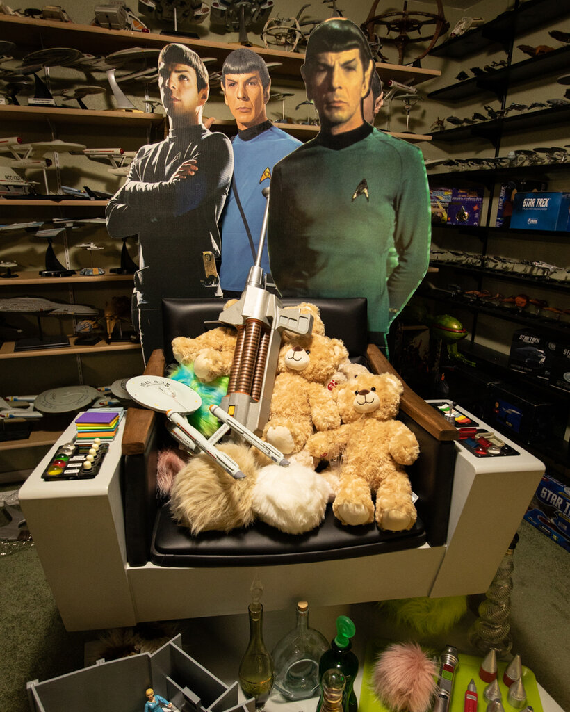 Three cutouts of the “Star Trek” character Spock stand in a room surrounded by other memorabilia from the science fiction series.