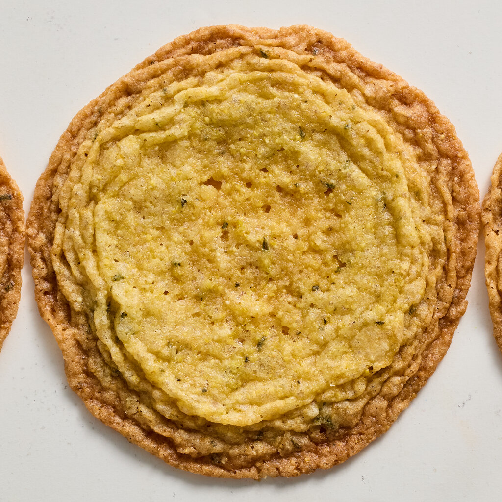 A yellow cookie viewed from above. 