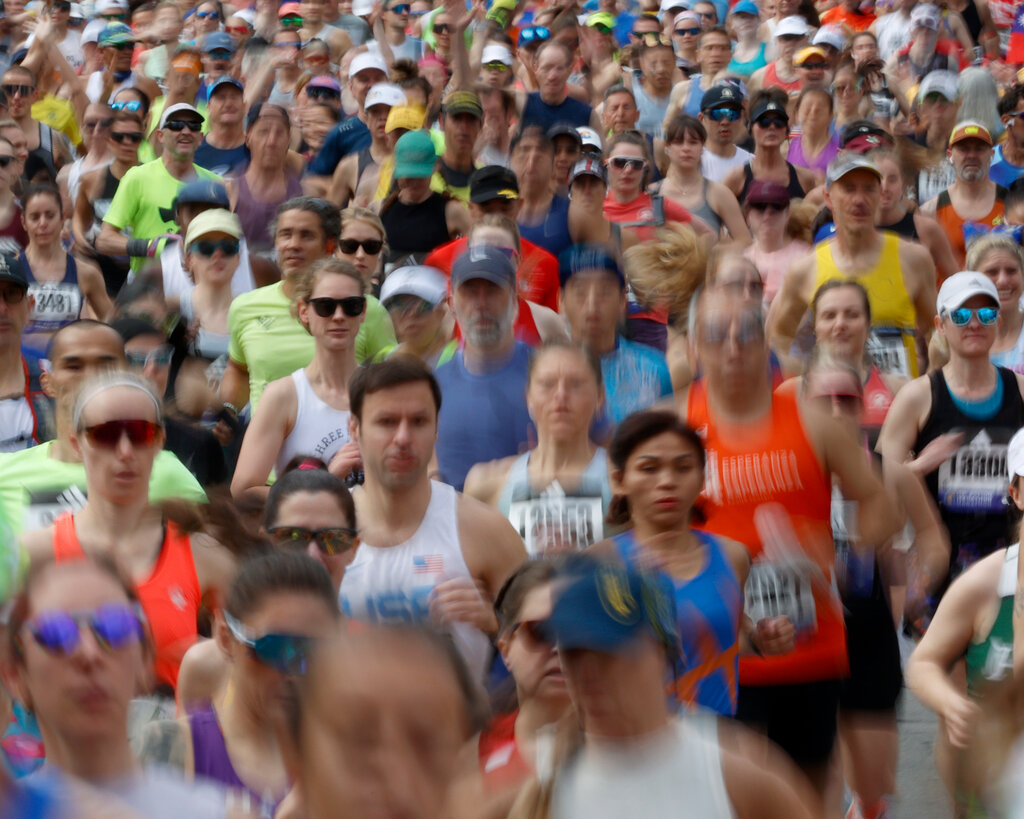 A blur of runners at a marathon. 