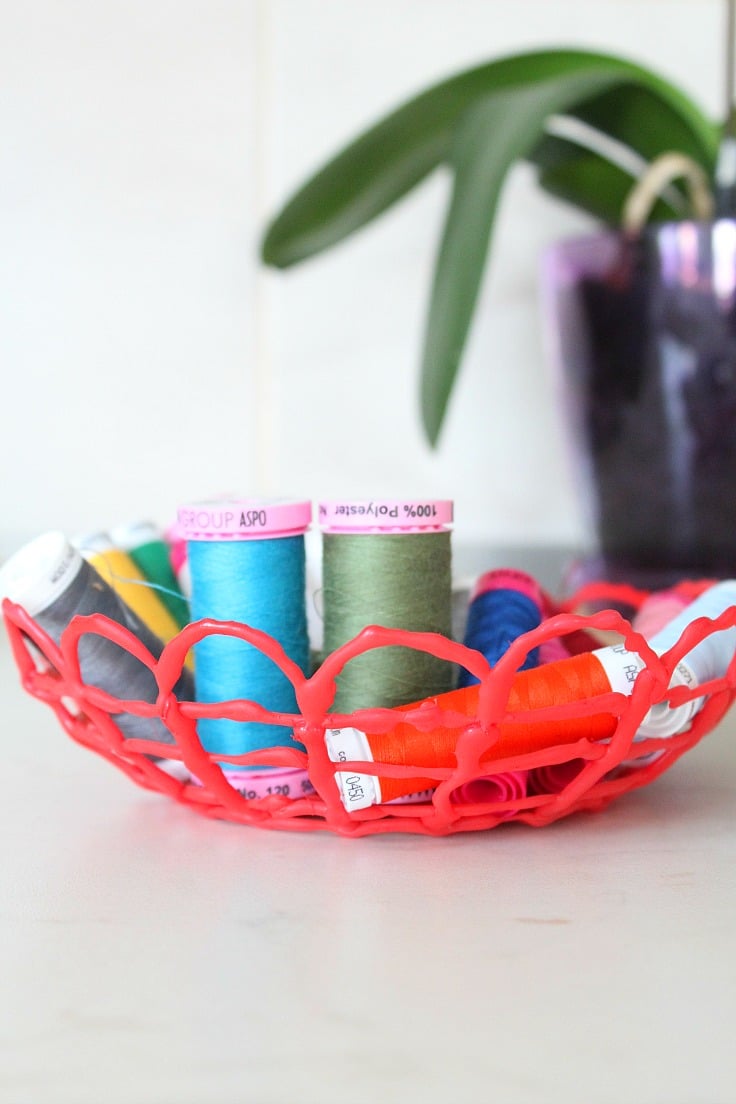 This hot glue bowl is a super cool, neat project to store sewing notions or craft supplies.