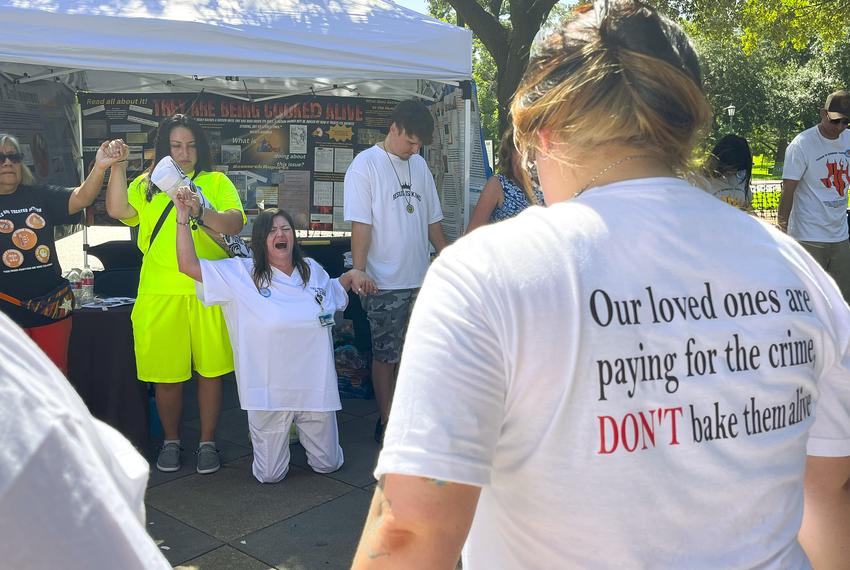 Tona Southards, whose 36-year-old son died in a Texas prison during the June 2023 heat wave, falls to her knees as she leads a prayer circle outside the Texas Capitol on July 18, 2023. Southards and other prison rights advocates called for Gov. Greg Abbott to call a special session to install air conditioning in Texas prisons.