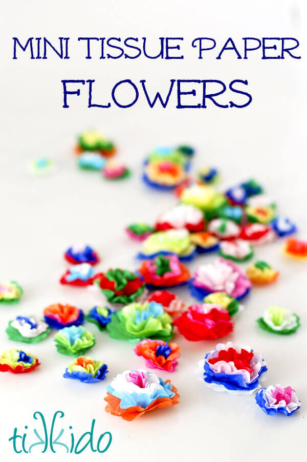 Colorful Mexican style miniature tissue paper flowers on a white background.
