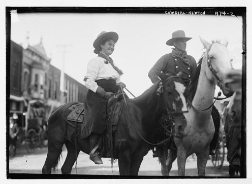 Cowgirl and cowboy on horseback, Newton, Kansas, 1908.