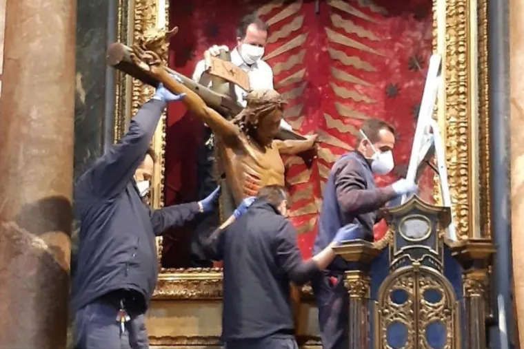 The miraculous crucifix is removed from the Church of San Marcello al Corso March 25. Courtesy photo.