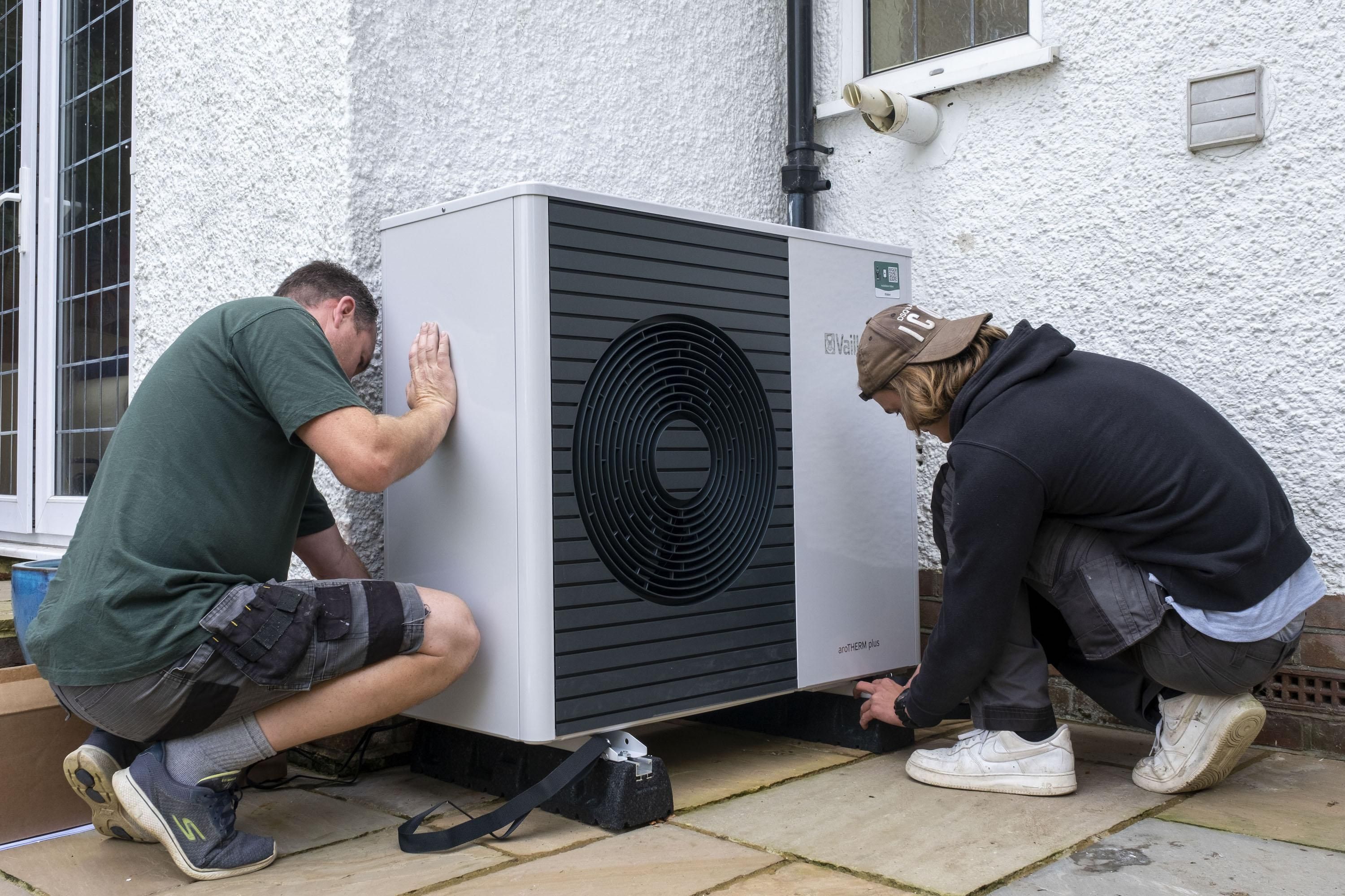 Air source heat pump installers from Solaris Energy installing a Vaillant Arotherm plus 7kw air source heat pump unit into a 1930s built house in Folkestone, United Kingdom on September 20, 2021.