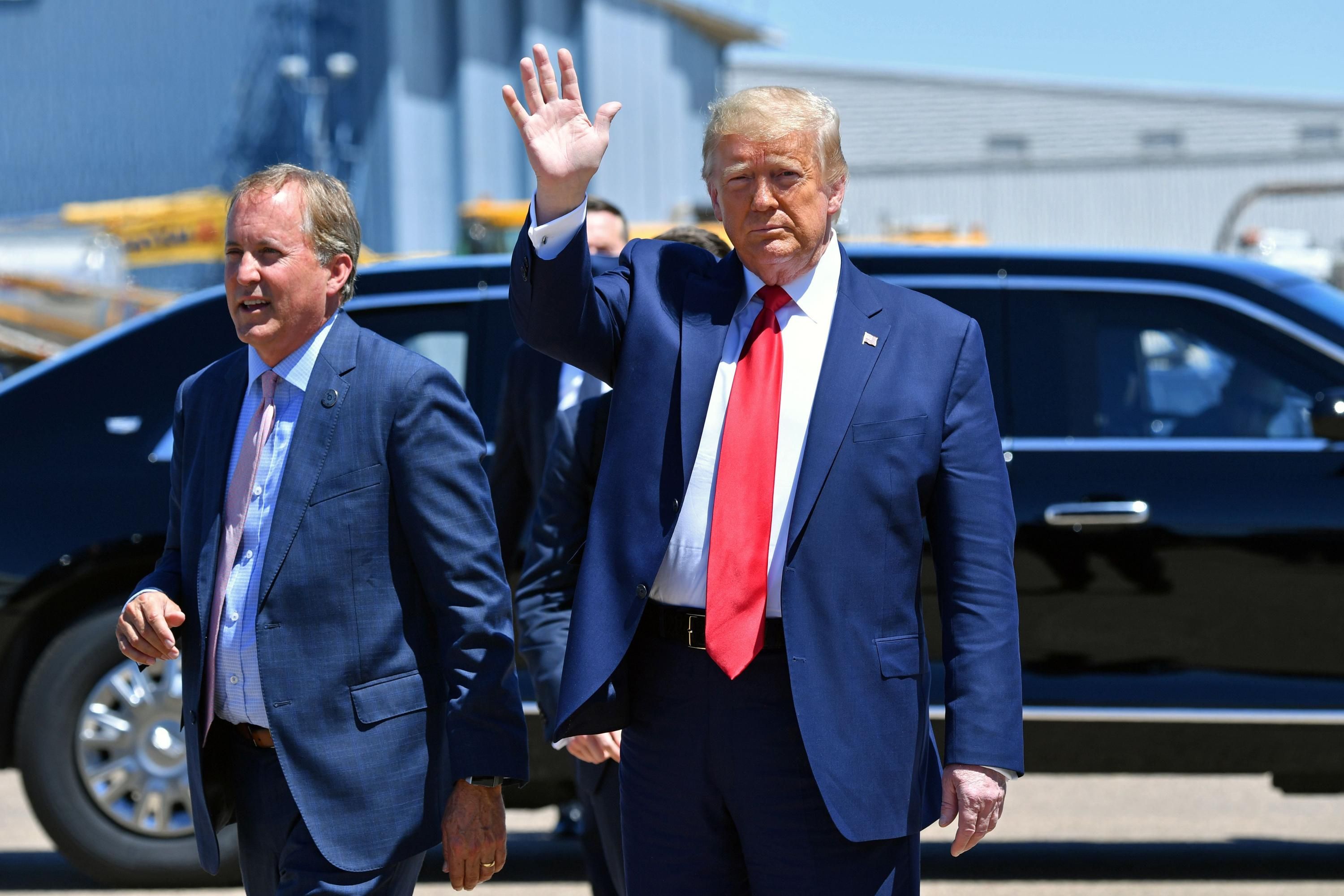 Then-President Donald Trump attends an event with Texas Attorney General Ken Paxton