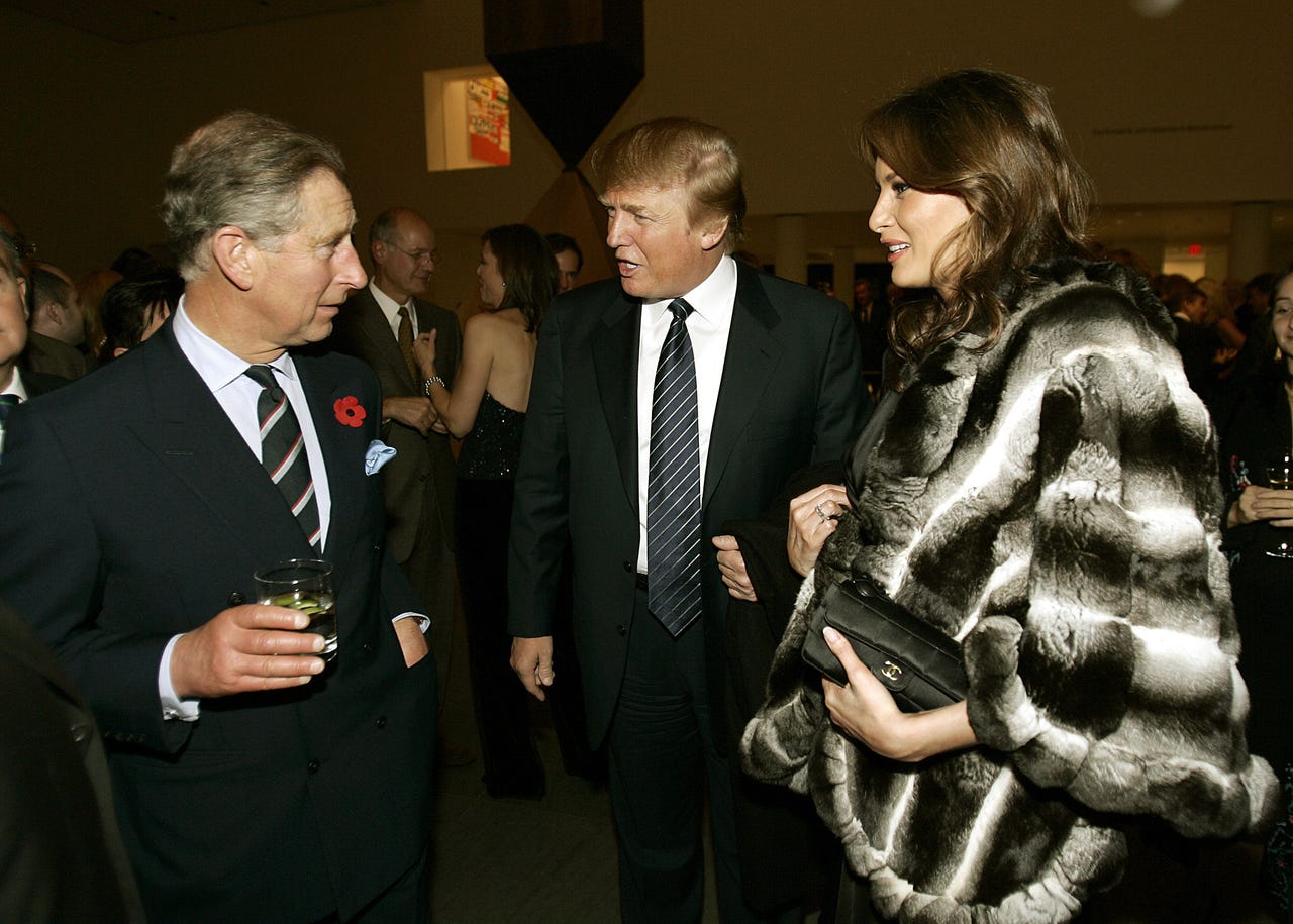 Britain's Prince Charles, left, talks with Donald Trump and his wife Melania during a reception at the Museum of Modern Art in New York on Nov. 1, 2005. 