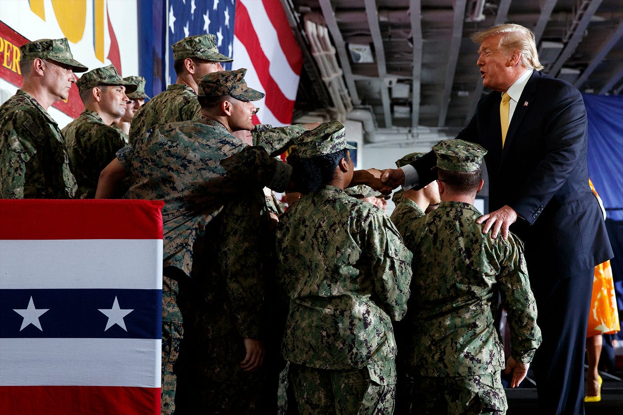 President Donald Trump greets troops after speaking at a Memorial Day event aboard the USS Wasp, Tuesday, May 28, 2019, in Yokosuka, Japan.