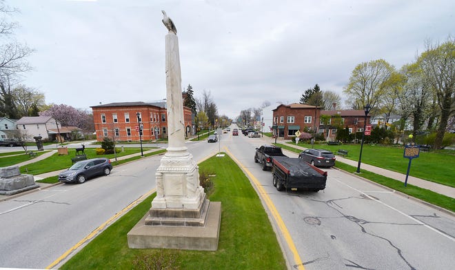 A monument, erected in 1865 to those who died in defense of the country, overlooks downtown Girard on Wednesday. Pennsylvania Route 20, looking east, doubles as Main Street through the small, historic town in western Erie County.