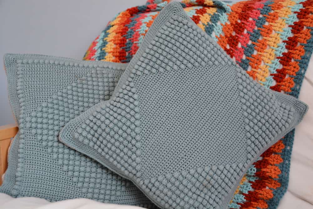 Free crochet pattern crochet bobble diamond cushions. Homeware, handmade home, handmade pillow, learn to crochet bobble stitch.